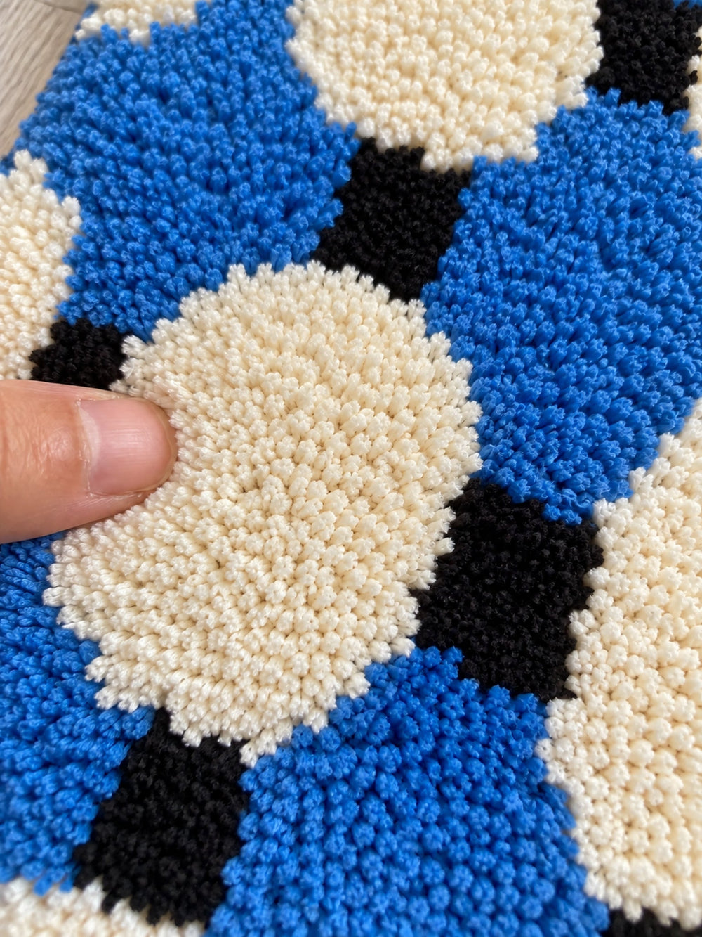 Close-up of the soft microfiber surface of Coastal Blue Basketweave Pattern Bath Mat