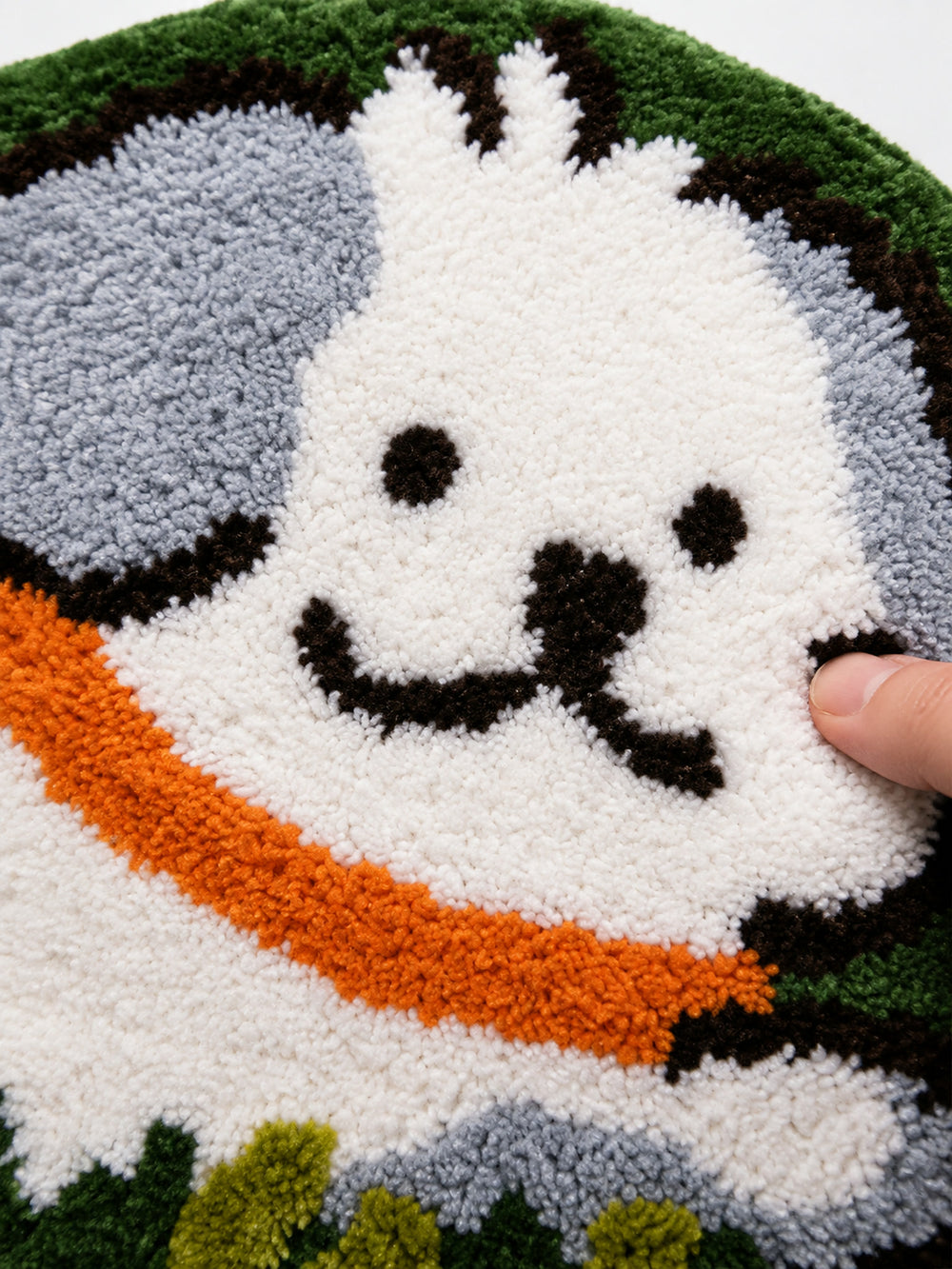 Close-up of the soft microfiber surface of Clover Meadow Pup Shaped Bath Mat