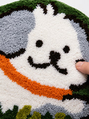 Close-up of the soft microfiber surface of Clover Meadow Pup Shaped Bath Mat