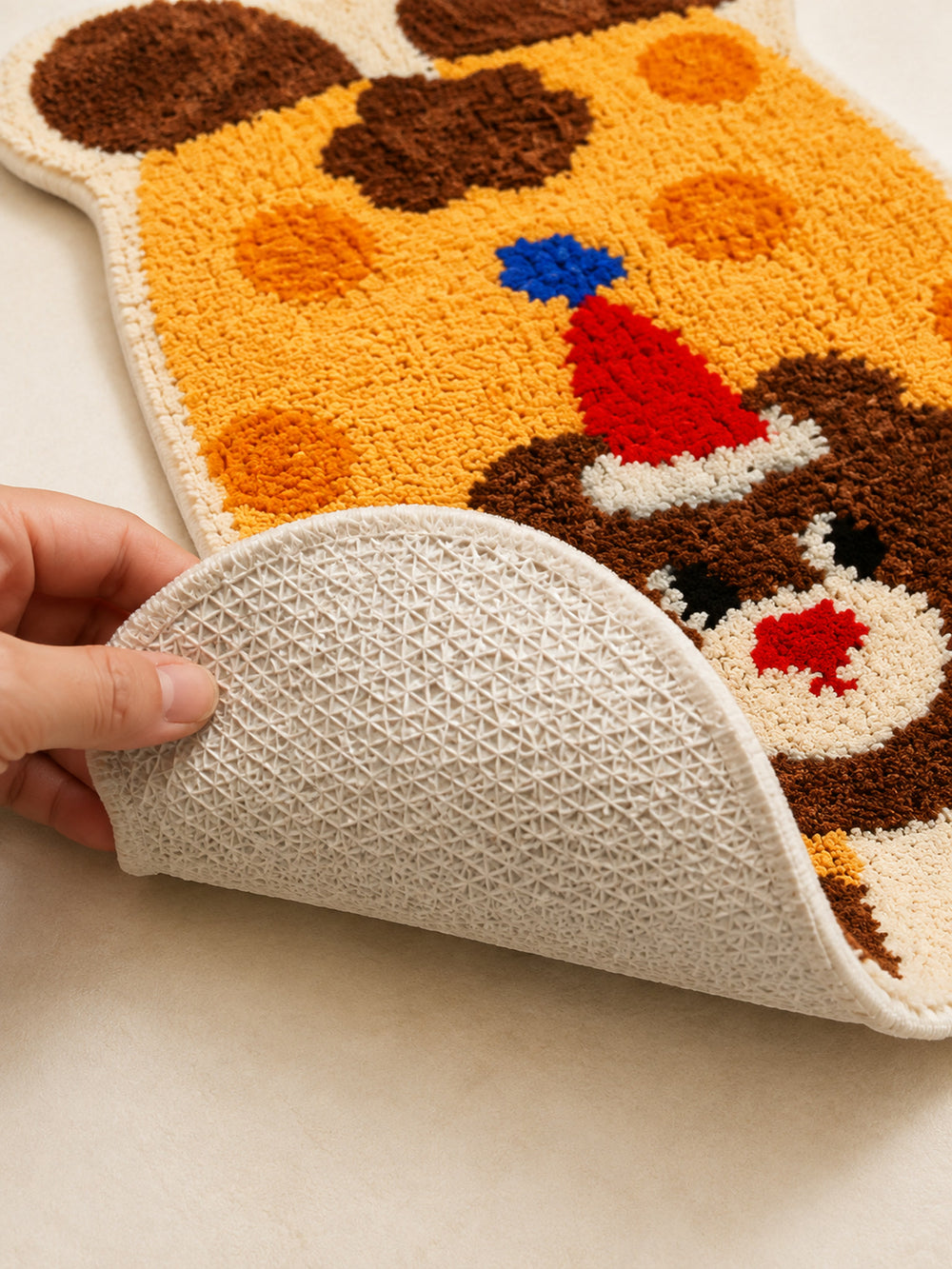 Close-up of the TPE backing of Party Bear Polka-Dot Bath Mat