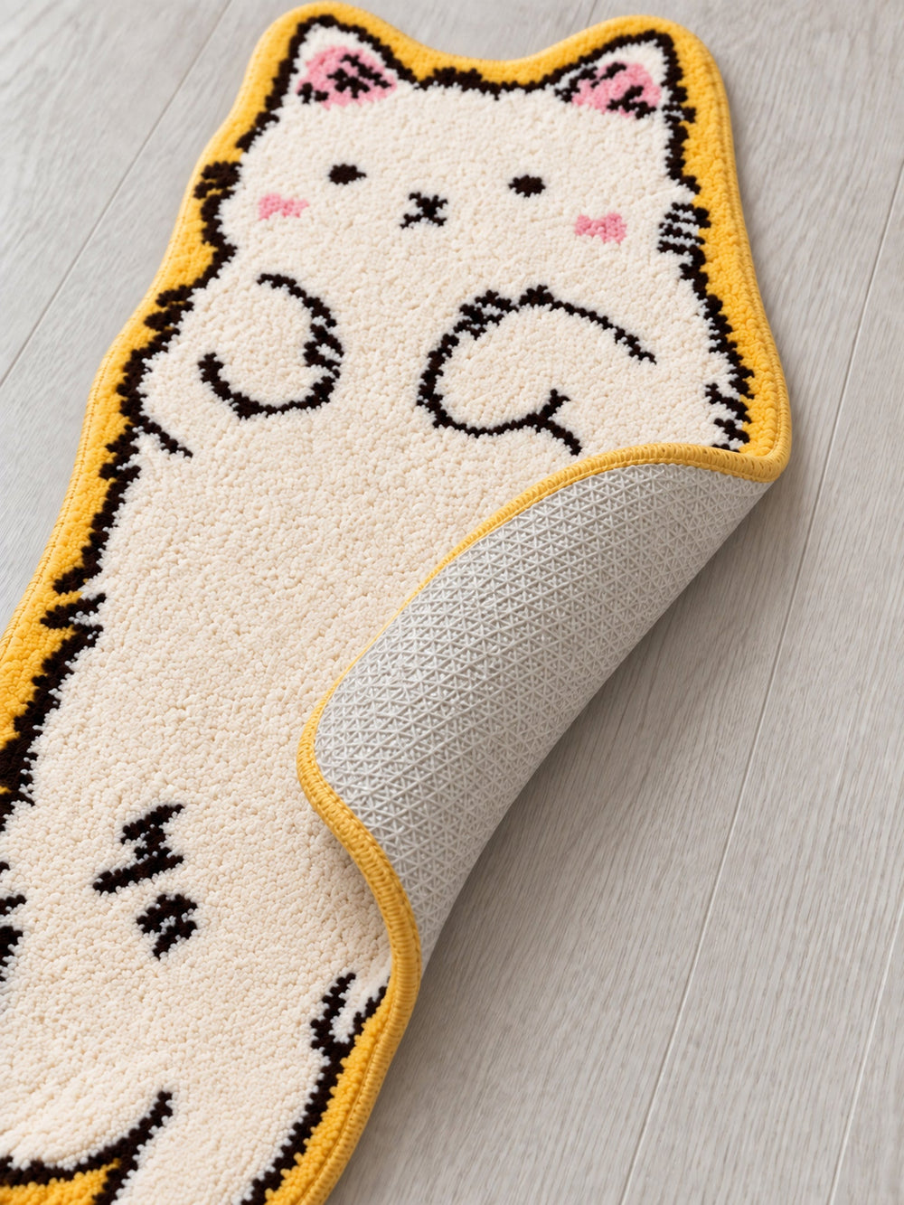 Close-up of the TPE backing of Long Cat Shaped Runner Rug - Ivory