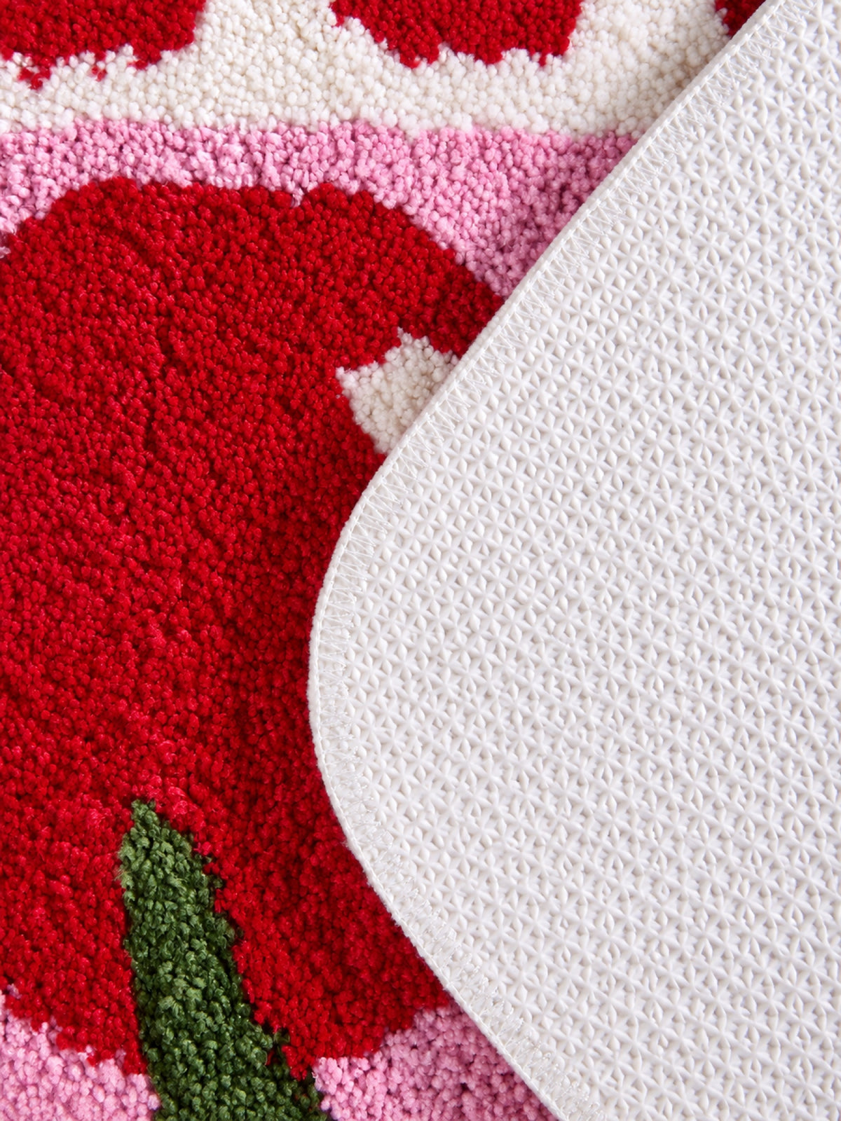 Close-up of the TPE backing of Retro Cherry Graphic Bath Mat - Pink