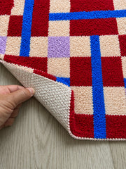 Close-up of the TPE backing of Crimson Grid Colorblock Bath Mat