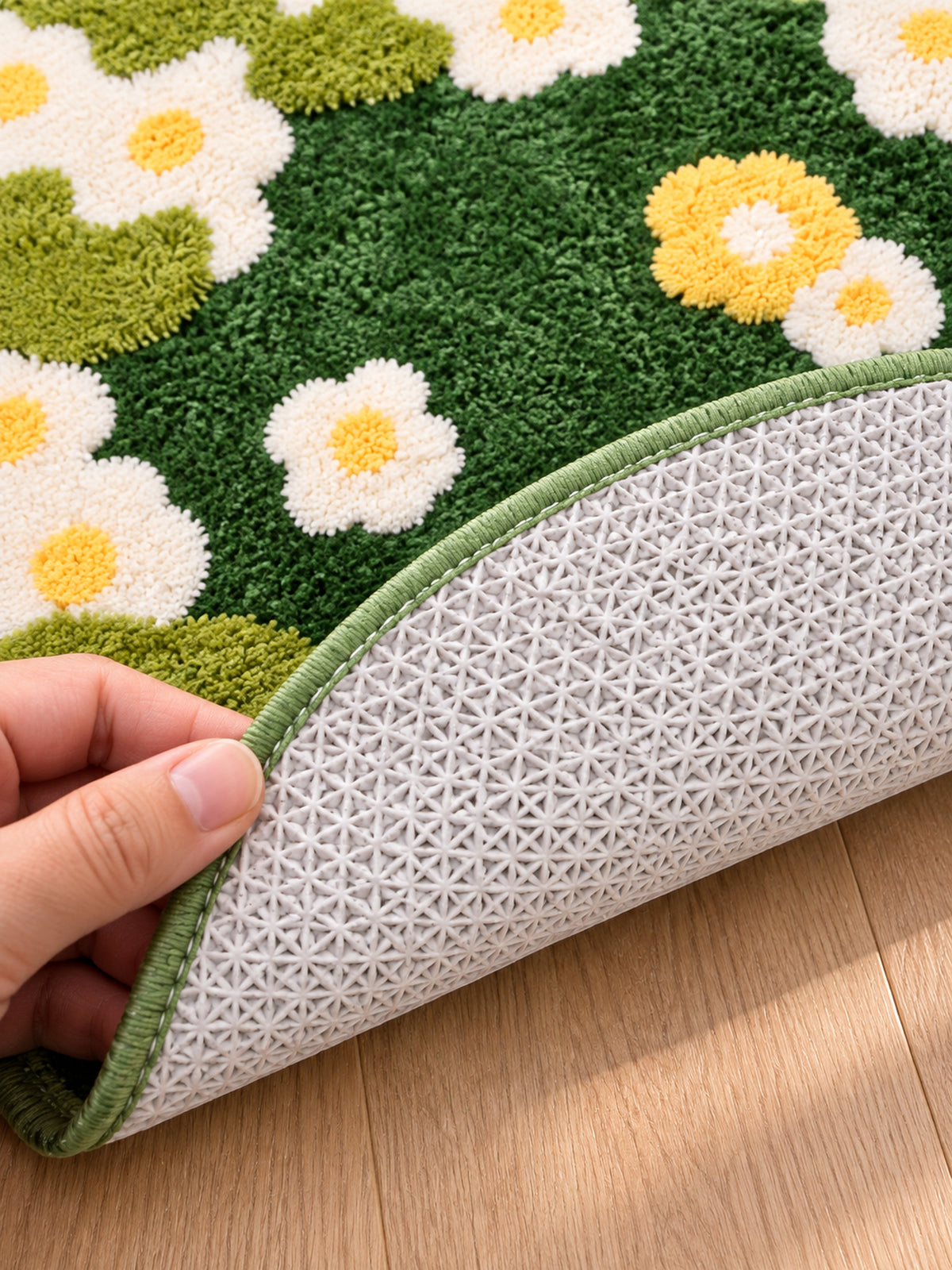 Close-up of the TPE backing of Daisy Meadow Floral Bath Mat & Runner Rug - Green
