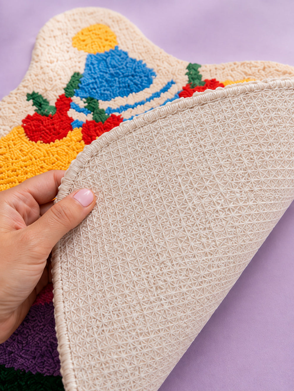 Close-up of the TPE backing of Best Wishes Cake Shaped Bath Mat