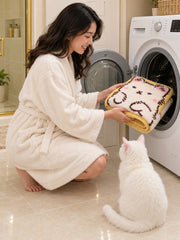 Long Cat Shaped Bath Mat - Ivory being machine washed