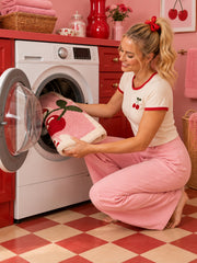 Retro Cherry Graphic Bath Mat - Pink being machine washed