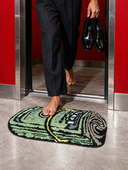 Rolled Cash Bath Mat on the floor at a doorway beneath bare feet