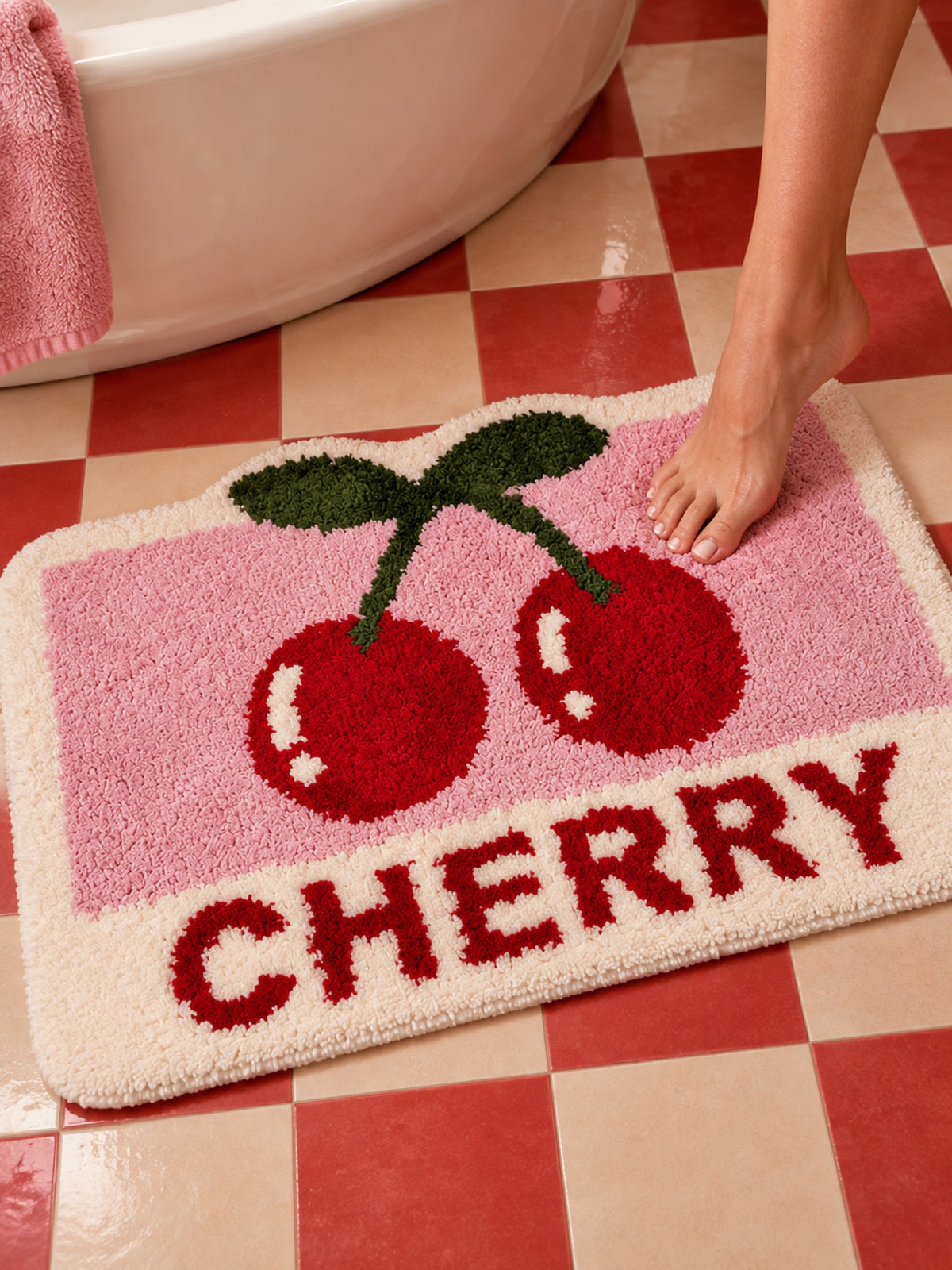 Retro Cherry Graphic Bath Mat - Pink on a bathroom floor, shown from another angle