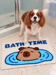 Capybara Bath Time Graphic Bath Mat on a bathroom floor, shown from another angle