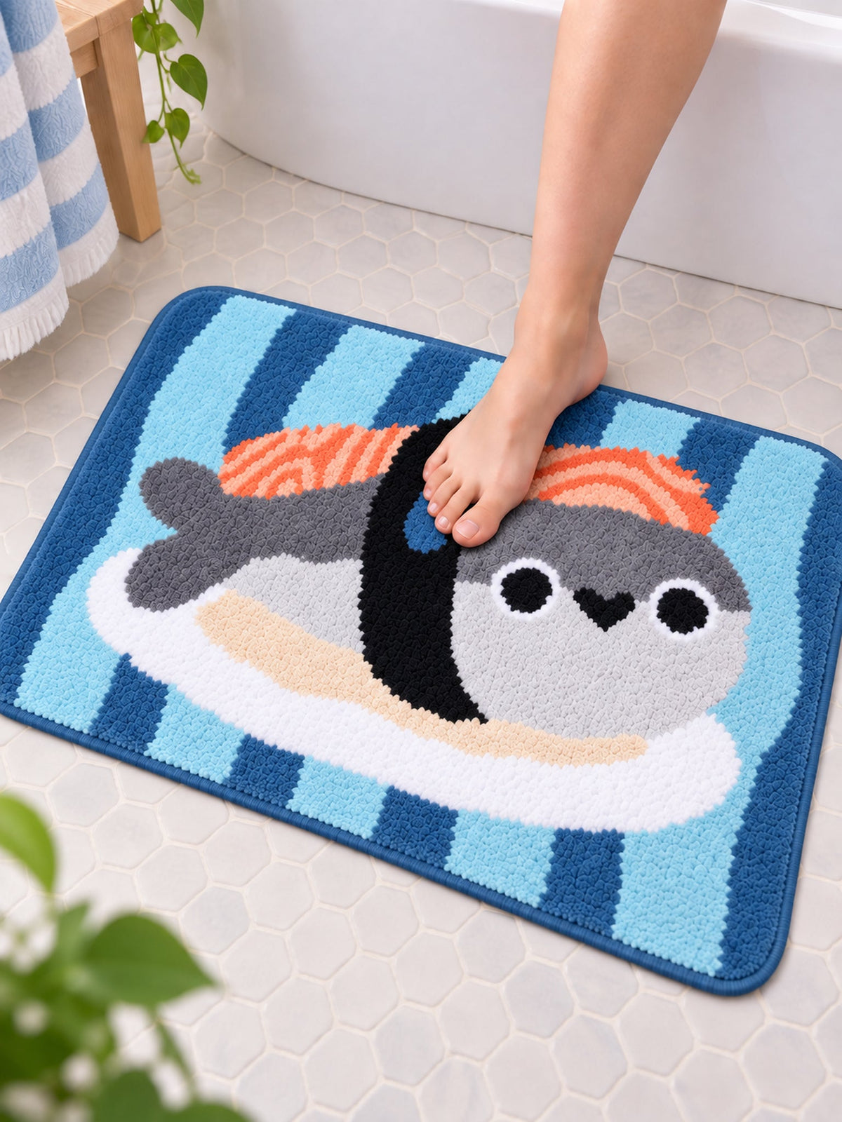 Sushi Fish Blue Stripe Bath Mat on a bathroom floor, shown from another angle