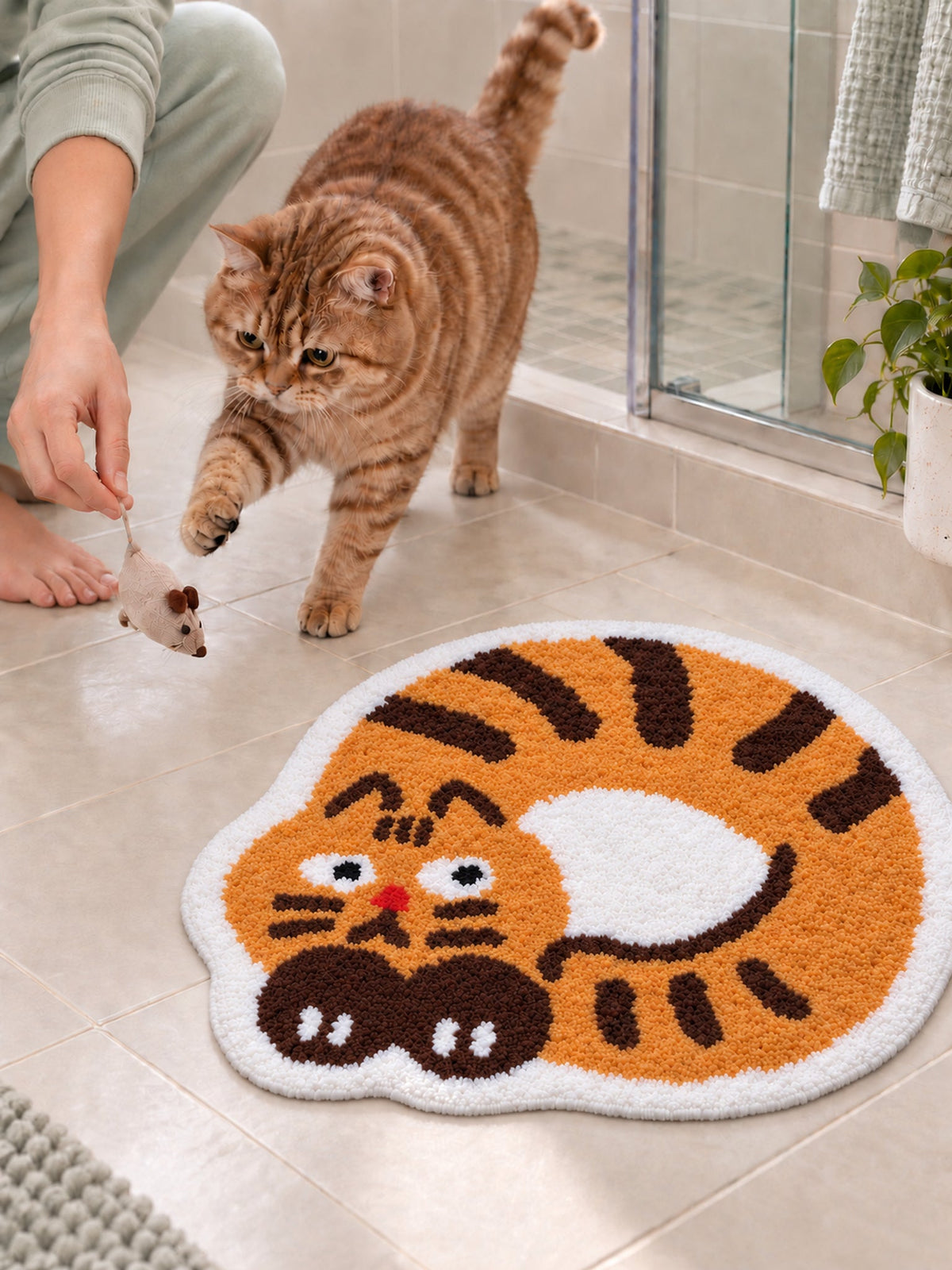 Curled Ginger Cat Shaped Bath Mat on a bathroom floor, shown from another angle