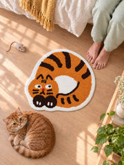 Curled Ginger Cat Shaped Bath Mat beside a bed, shown from another angle