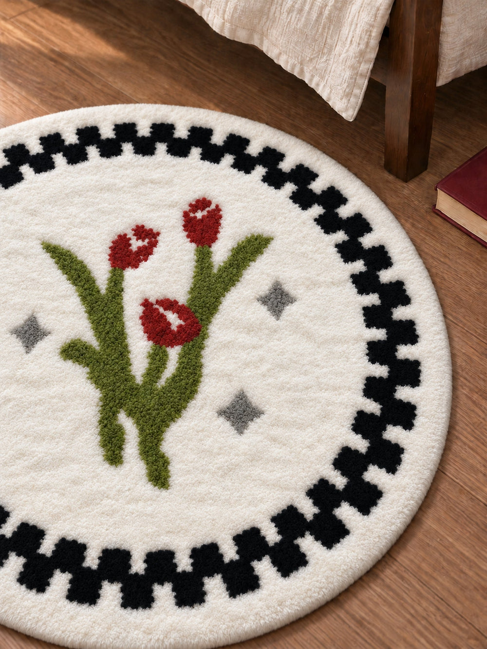 Heritage Tulip Round Bath Mat beside a bed, shown from another angle