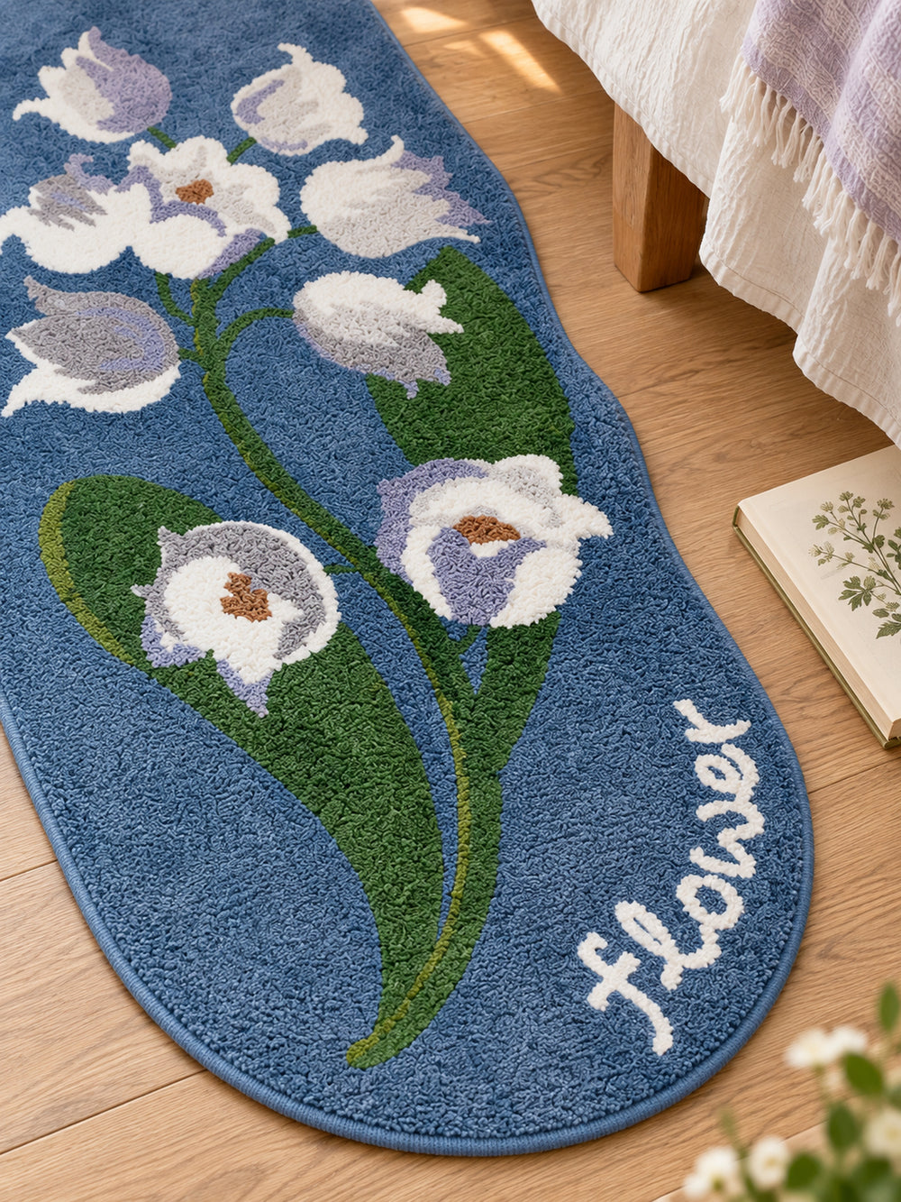 Midnight Garden Blue Floral Bath Mat beside a bed, shown from another angle