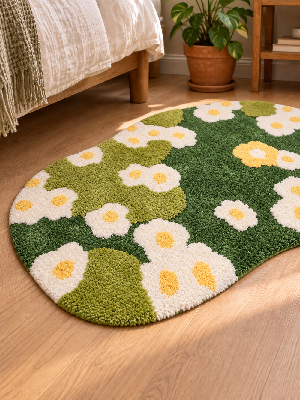 Daisy Meadow Floral Bath Mat & Runner Rug - Green beside a bed, shown from another angle