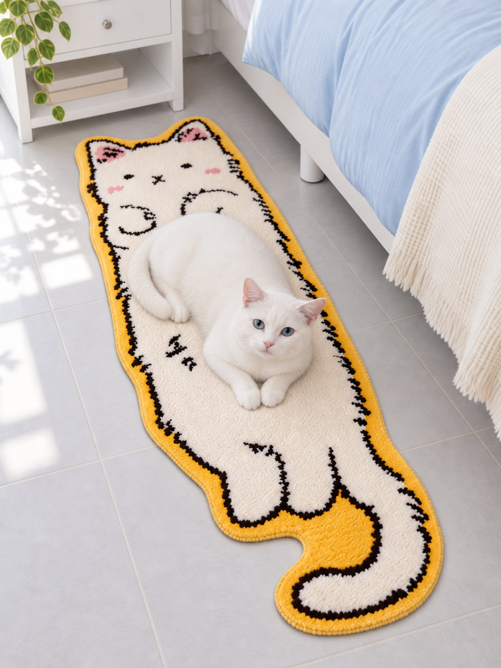 Long Cat Shaped Runner Rug - Ivory beside a bed, shown from another angle