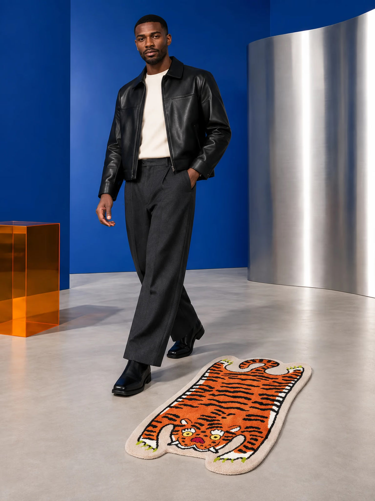 Resting Tiger Shaped Bath Mat on a gray floor beside a person in black shoes