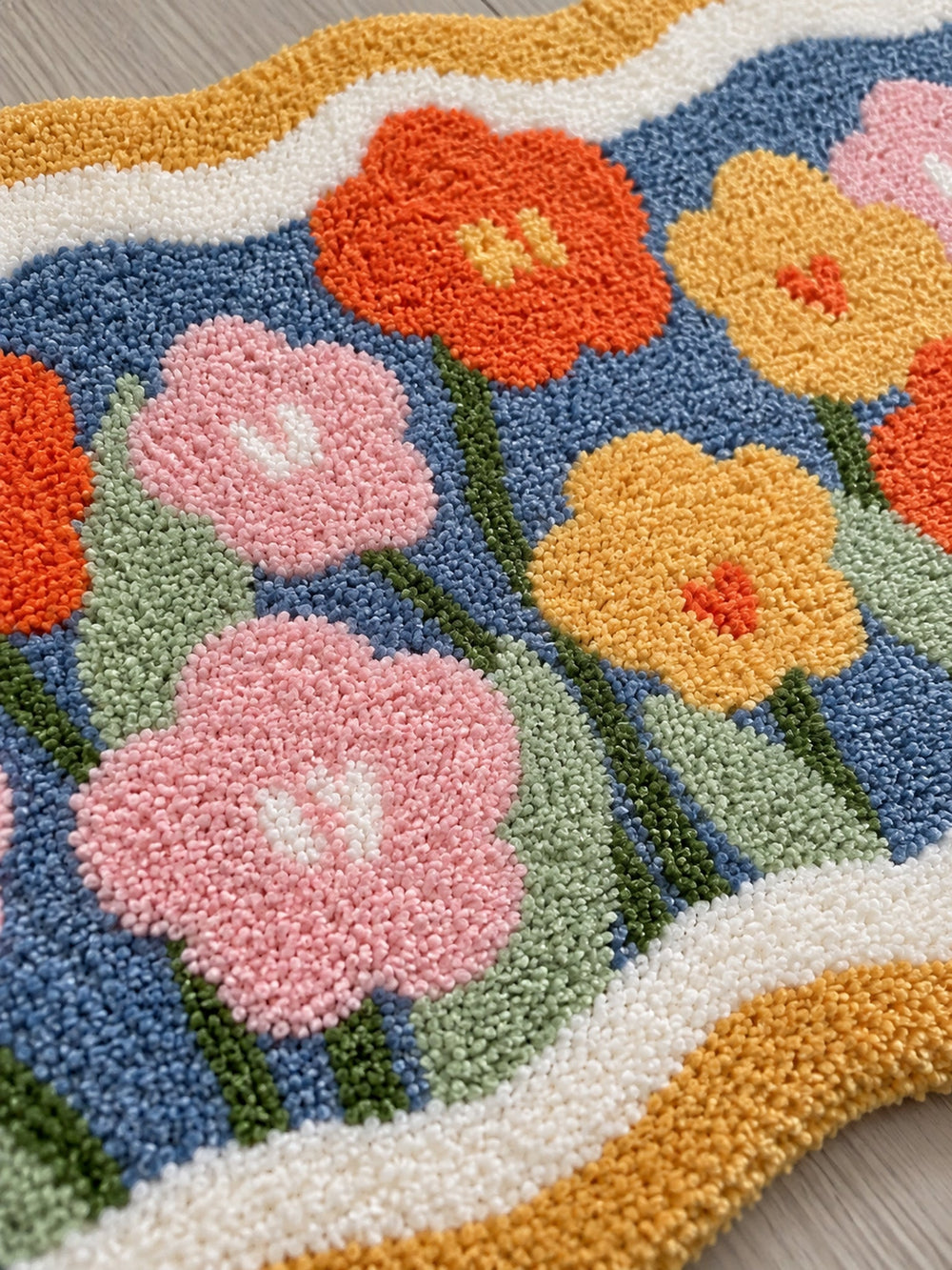 Garden Bloom Wavy Border Bath Mat — surface detail