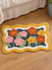 Garden Bloom Wavy Border Bath Mat — bedside context detail