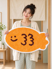 Smiling Orange Fish Shaped Bath Mat — happy companion