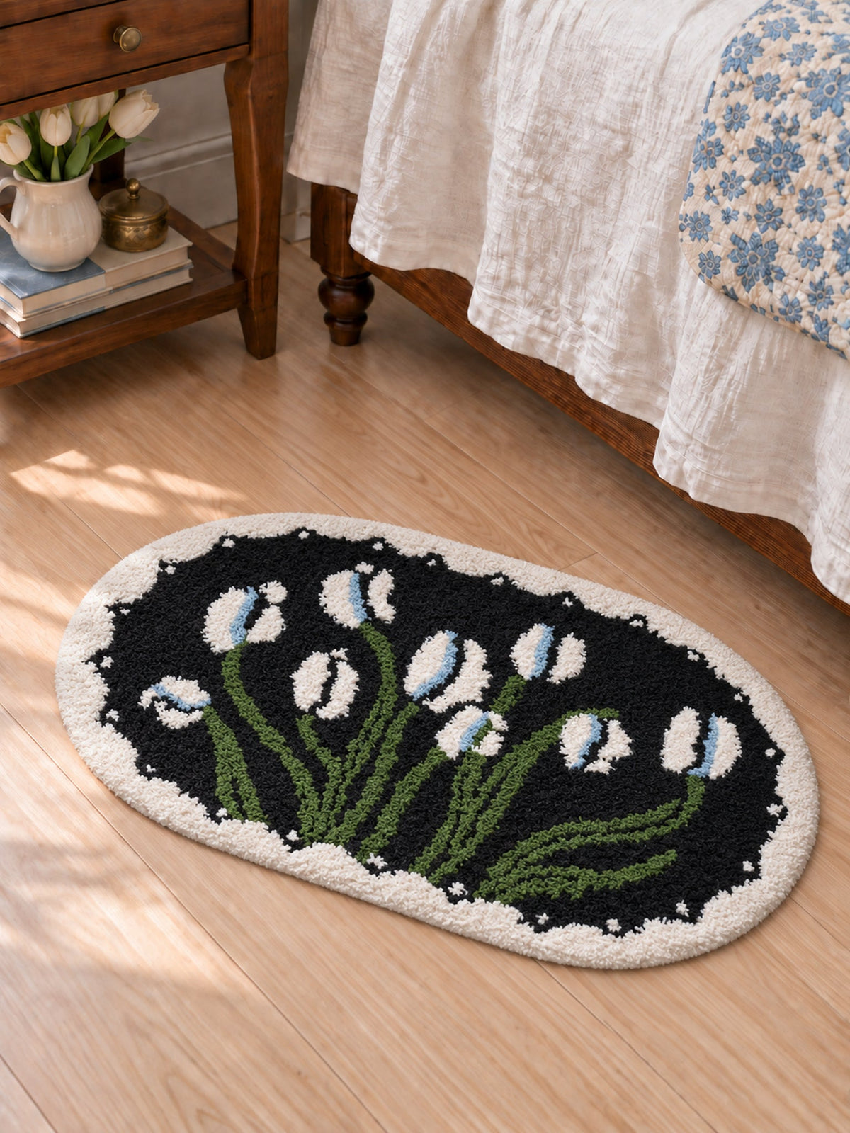 Floral Study Oval Bath Mat - Midnight — bedside context detail