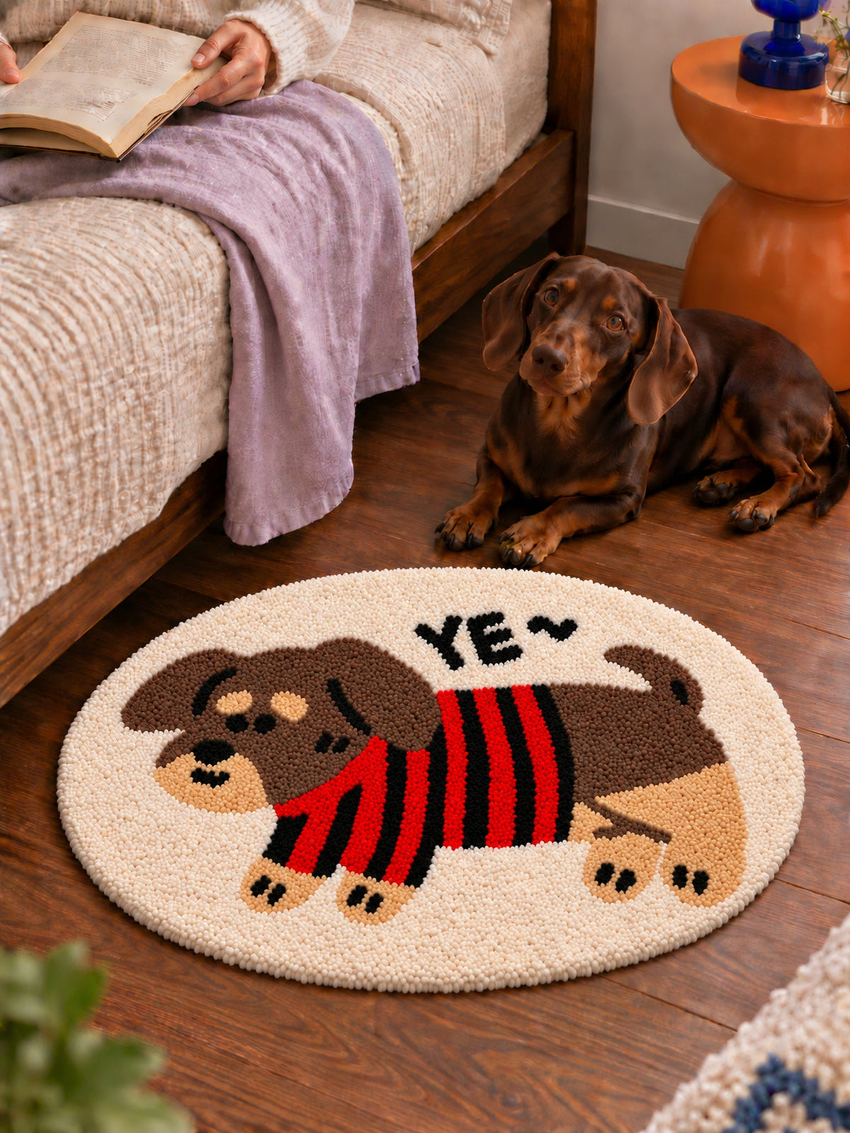 Striped Sweater Dachshund Oval Bath Mat — bedside scene