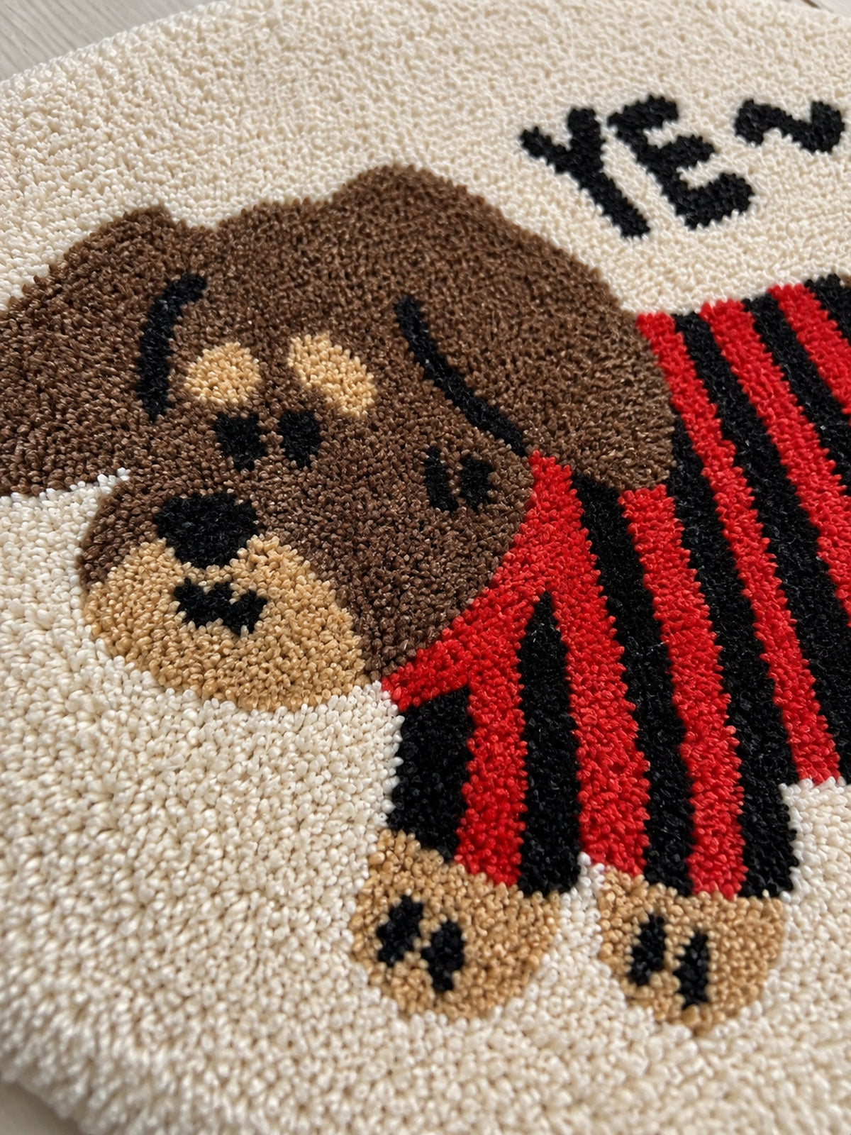 Striped Sweater Dachshund Oval Bath Mat — surface detail