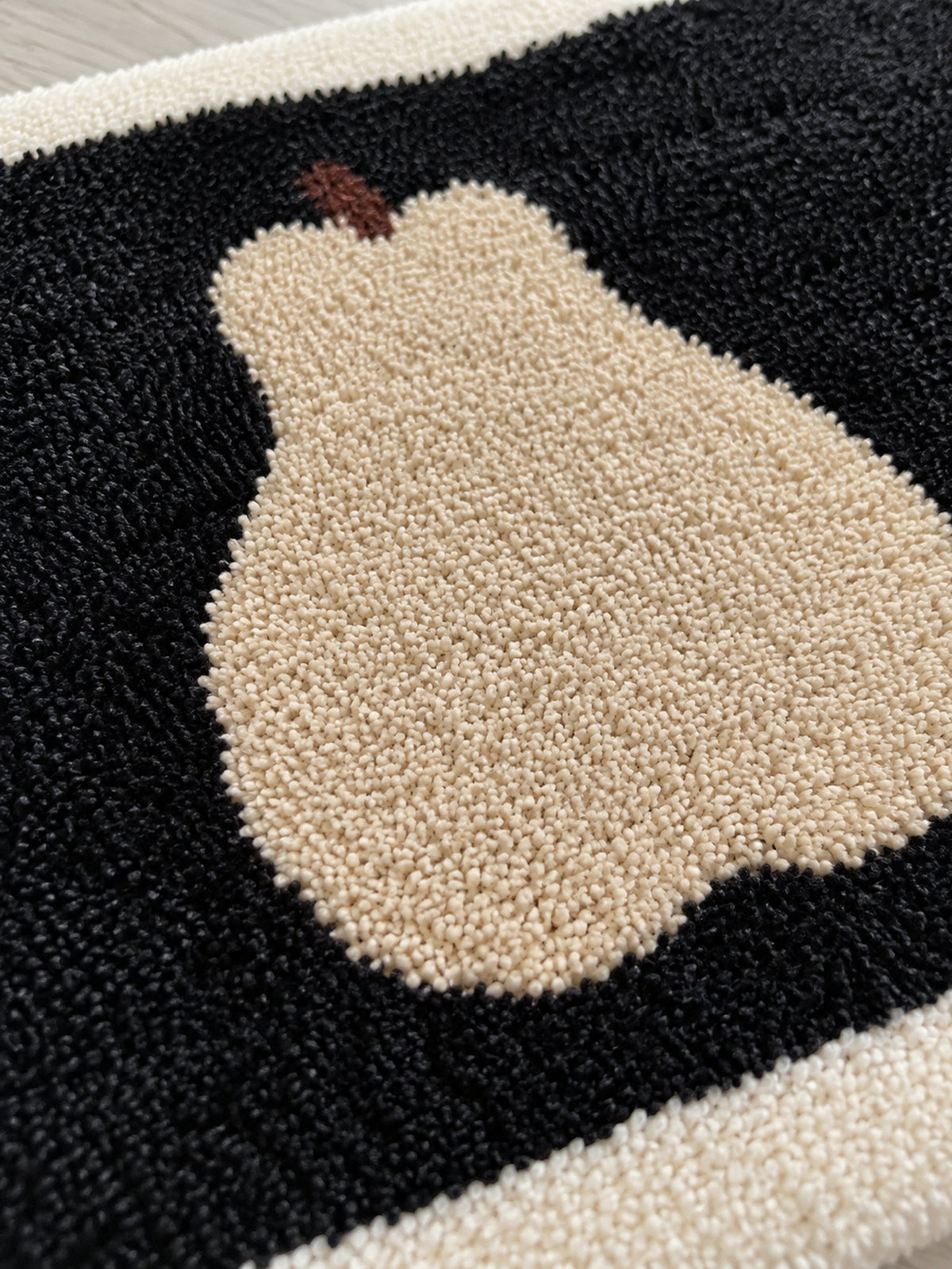 Midnight Pear Silhouette Bath Mat — surface detail