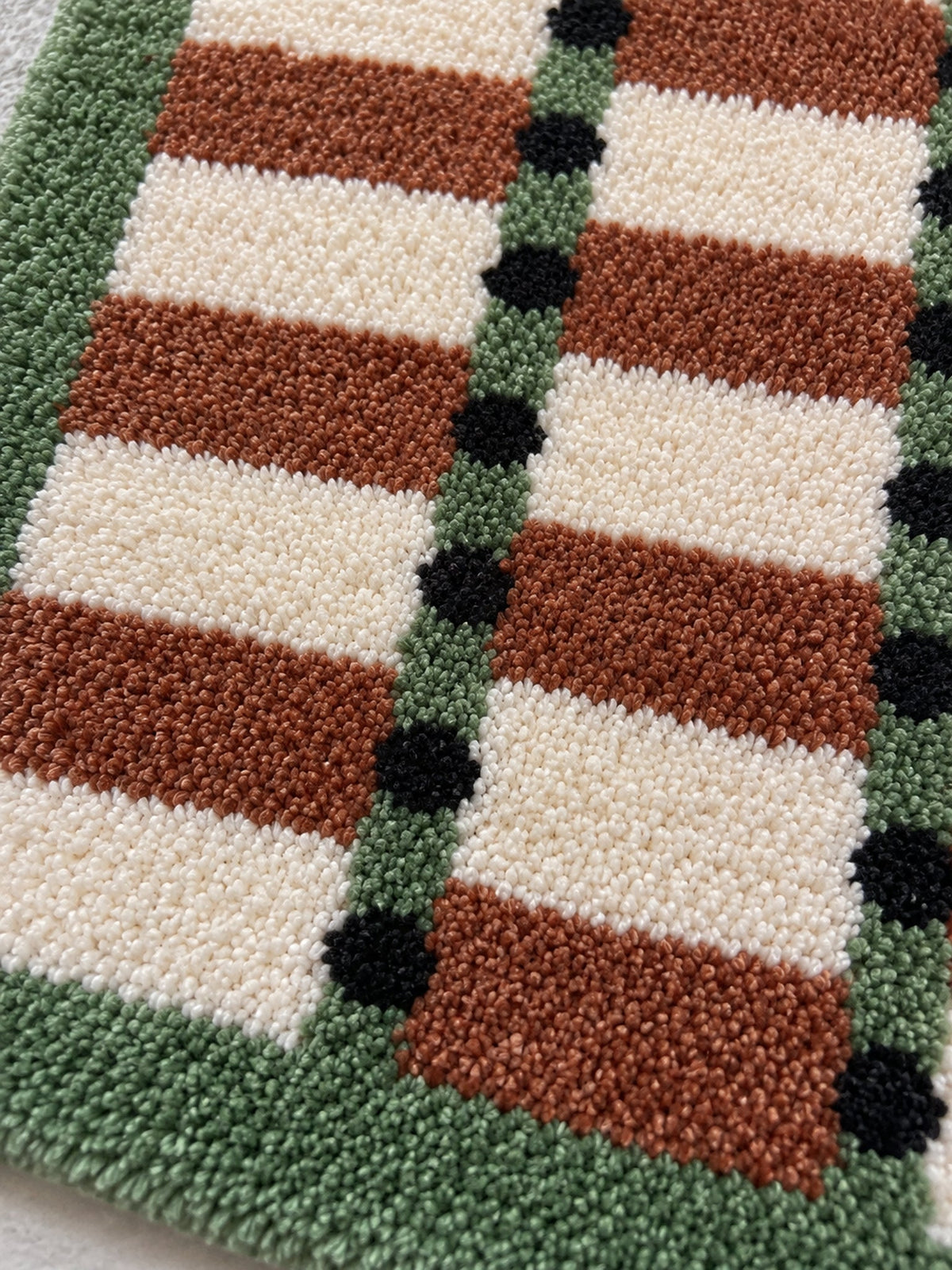 Sage Cocoa Grid Geometric Bath Mat — surface detail