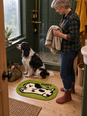 Stretching Spotted Puppy Bath Mat - Green — bathroom scene